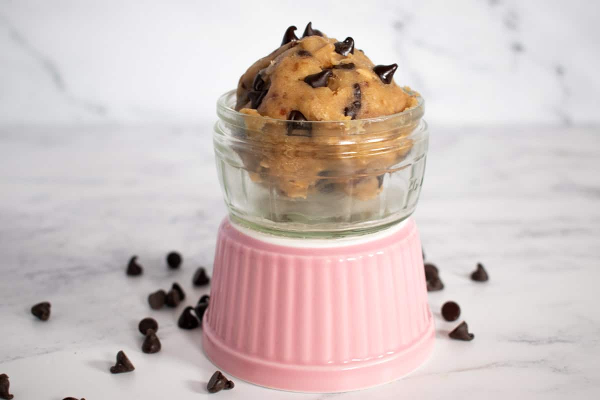 A scoop of vegan cookie dough in a ramekin.