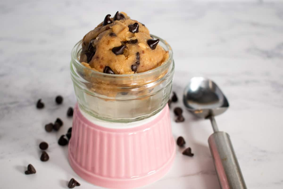 A scoop of vegan cookie dough in a ramekin.