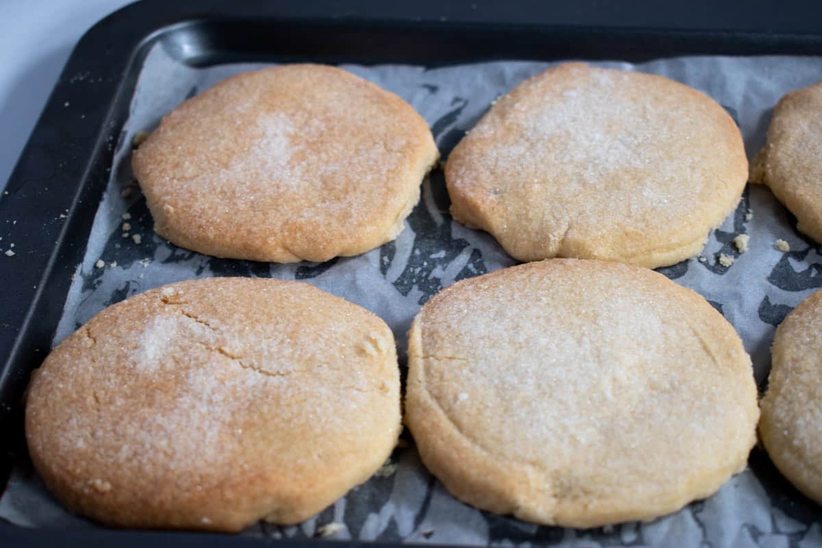 Baked vegan shortbread cookies on a baking tray.