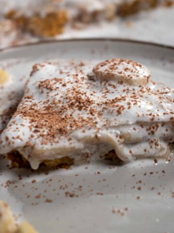 A large slice of vegan banoffee pie on a white plate.