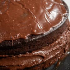 A whole chocolate ganache cake.