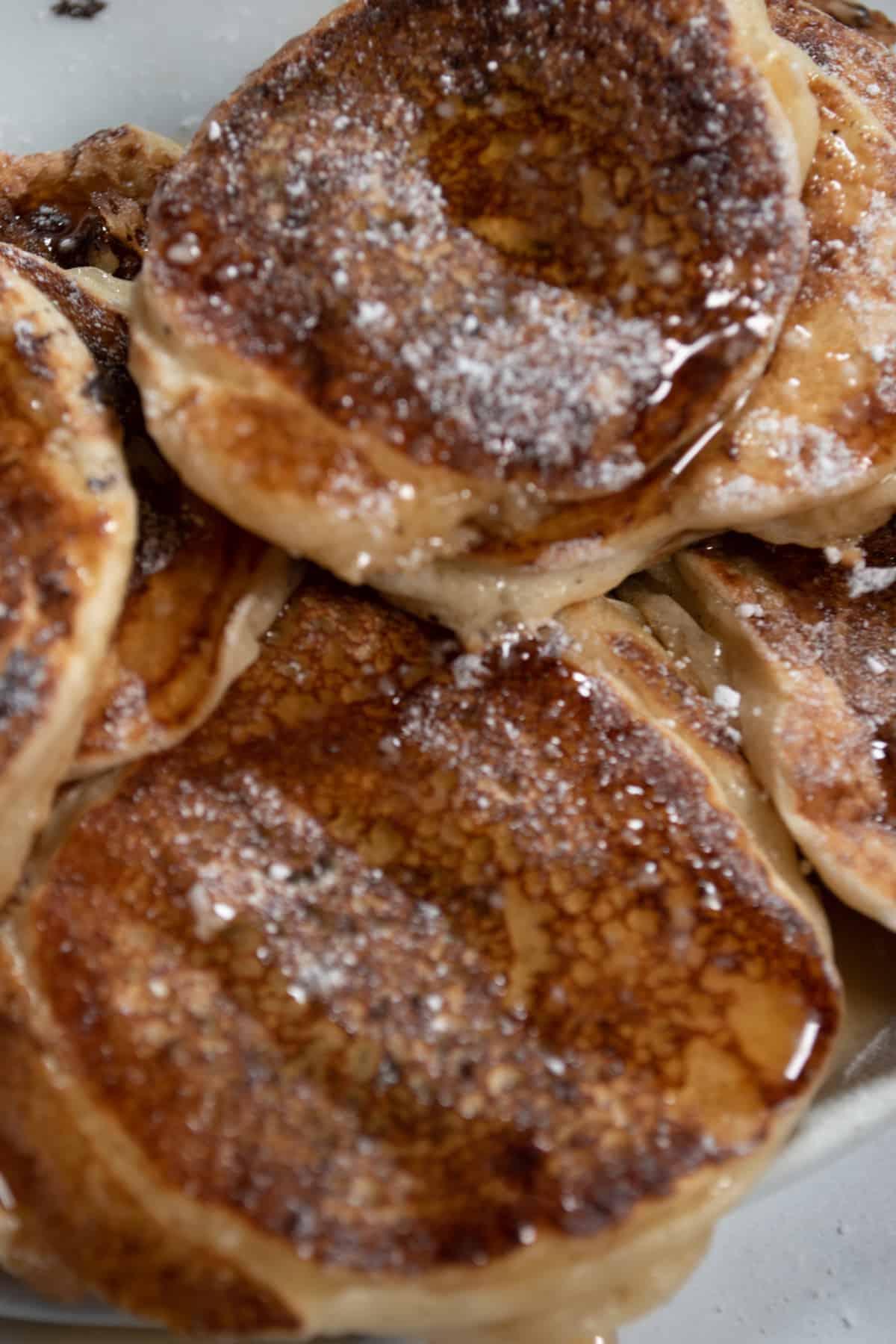 A close up shot of the maple-topped pancakes. 