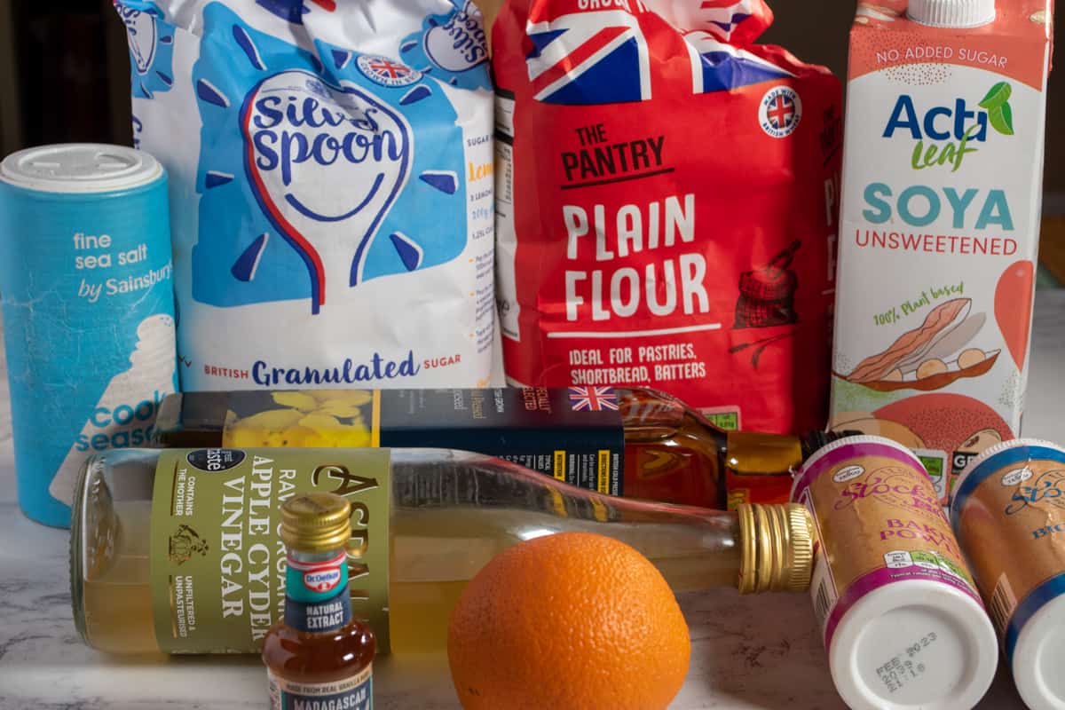 A shot of the ingredients needed to make an eggless orange cake.