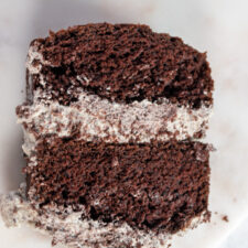 A large slice of my eggless chocolate Oreo cake, filled with Oreo buttercream.