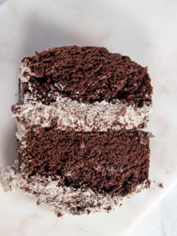 A large slice of my eggless chocolate Oreo cake, filled with Oreo buttercream.
