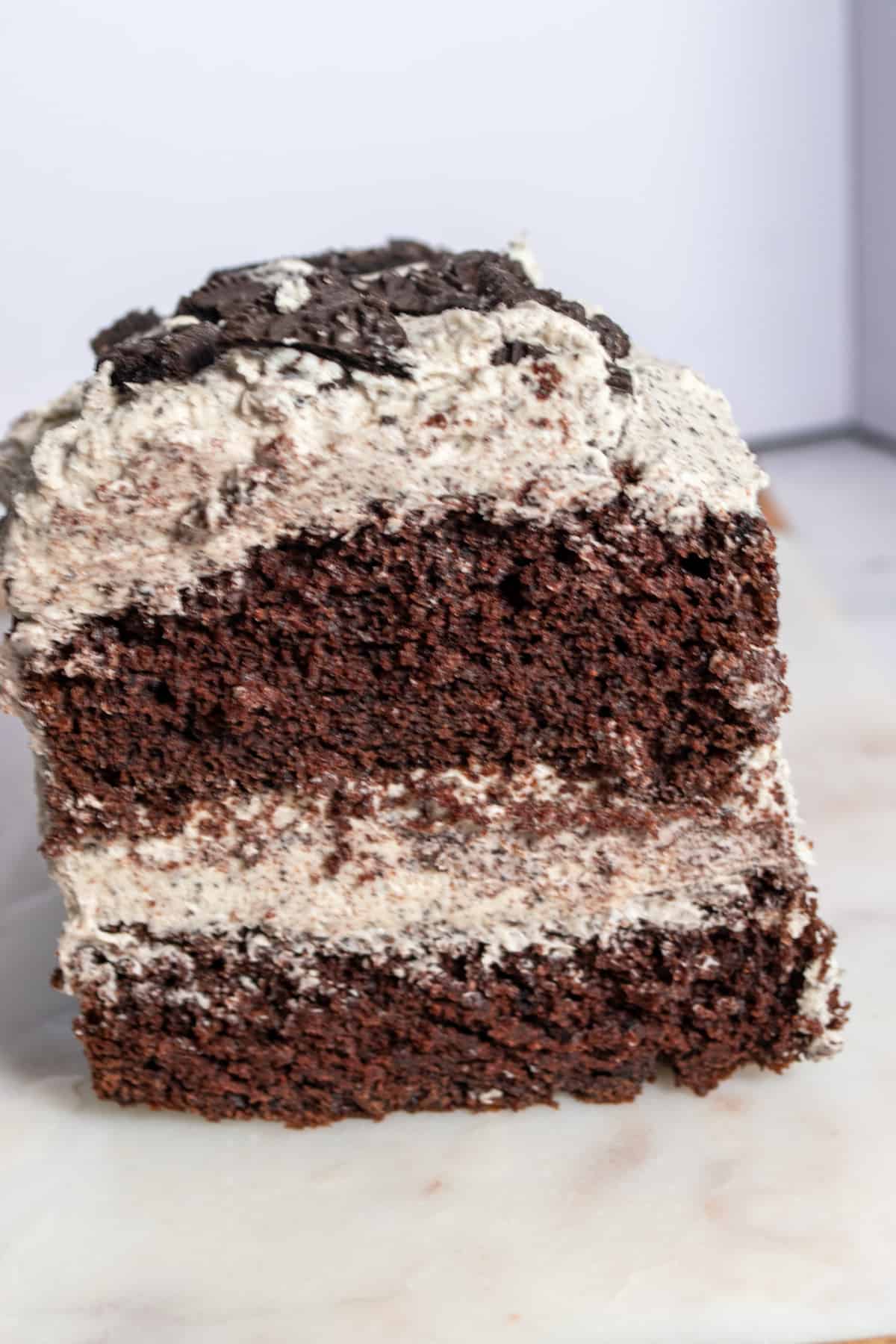 A whole loaf of my eggless oreo cake. You can see the moist insides of the cake as the front has been sliced off.