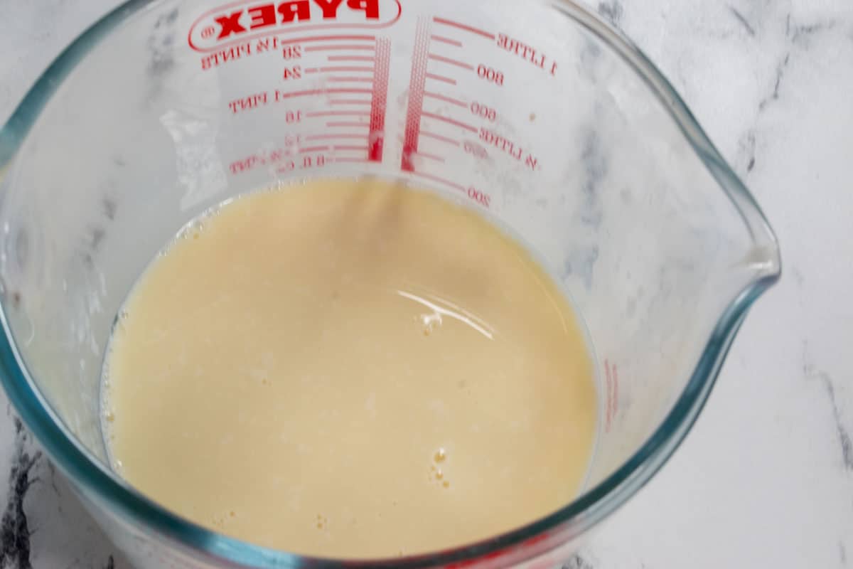 The vegan buttermilk in a pyrex measuring jug. 