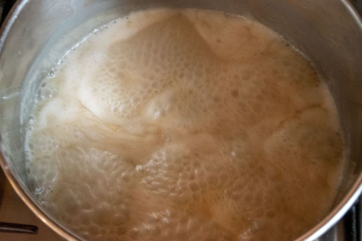 The boiling mixture in the pan, reduced to a simmer. 