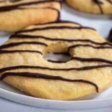 A zoomed in shot of a copycat vegan fudge stripe cookie on a white plate.