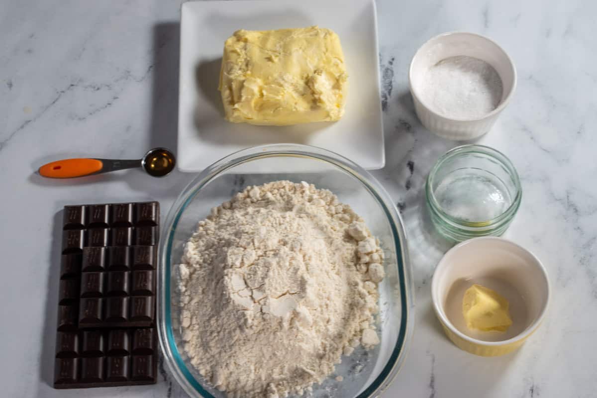 The ingredients which are needed to make copycat  vegan fudge stripe cookies.