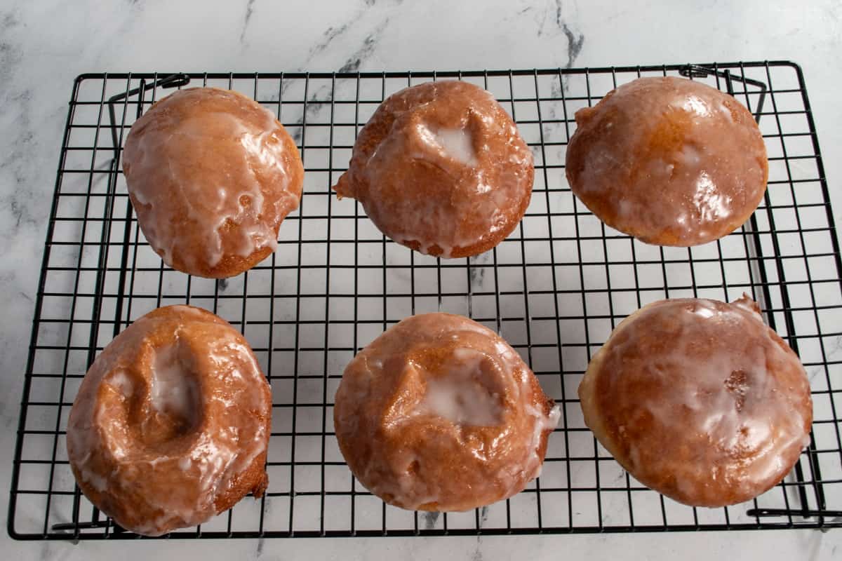 The glaze has been added to the donuts.