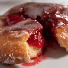 A zoomed in shot of one of my raspberry filled donuts. Lots of raspberry jelly inside.