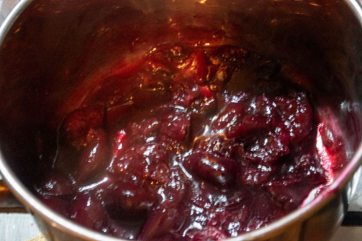 The cherry compote has thickened in the pan. 