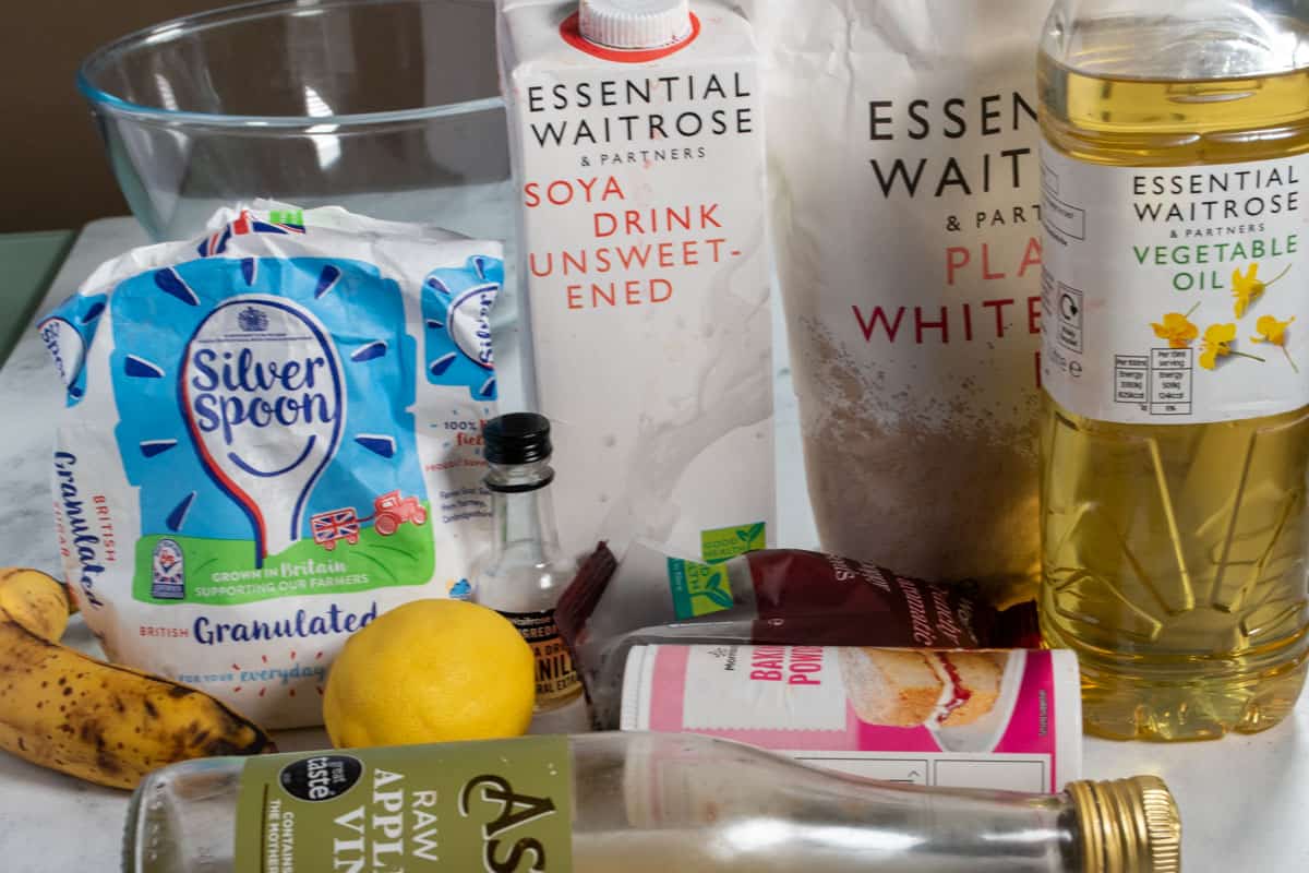 A horizontal shot showing all, the ingredients needed for my vegan lemon poppy seed muffins.