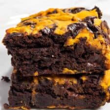 A zoomed in shot of two pumpkin brownies stacked.
