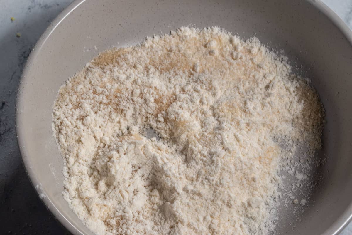 Brown sugar and flour combined in a small plate. 