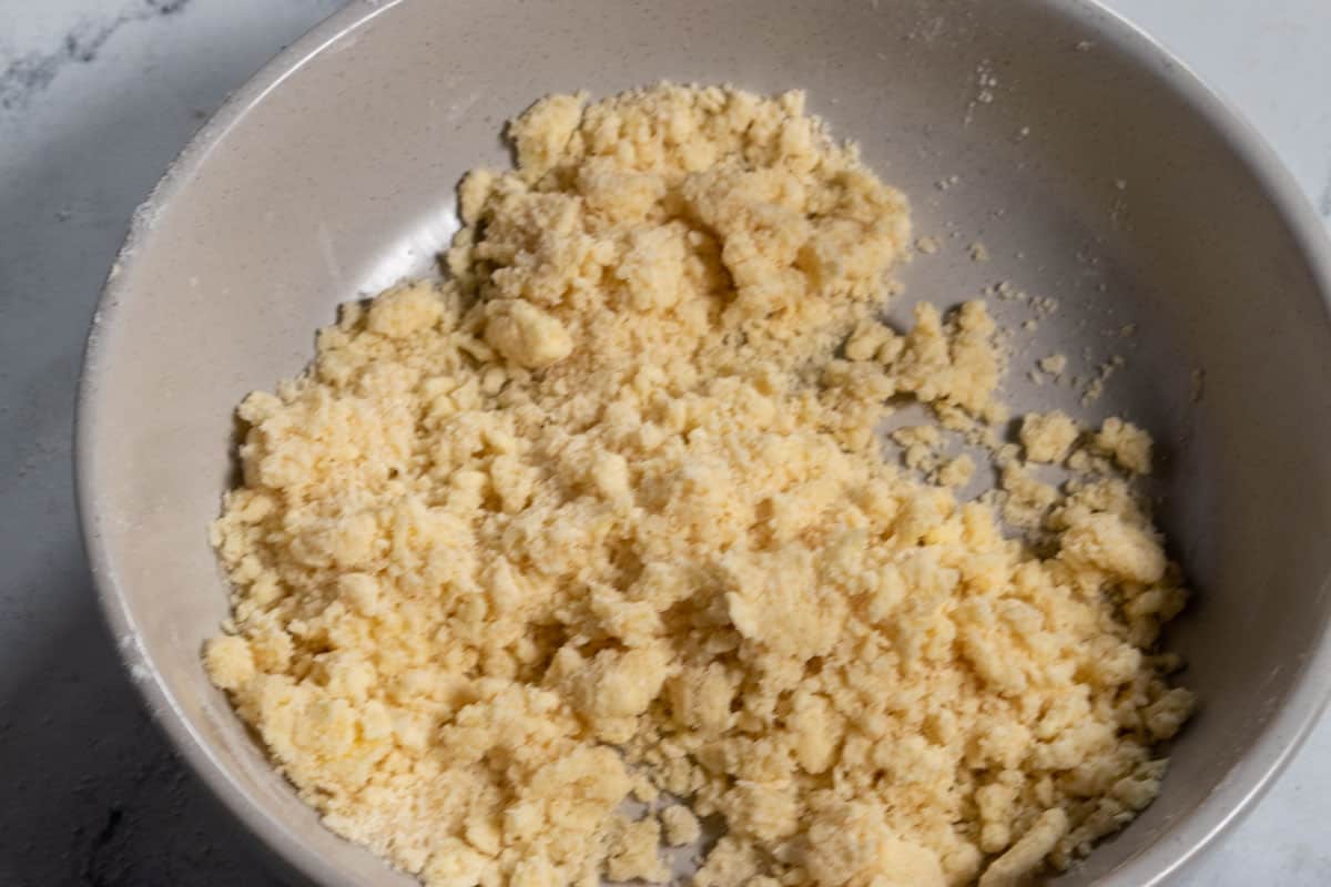 Vegan butter added to the flour and sugar to create crumbly streusel. 