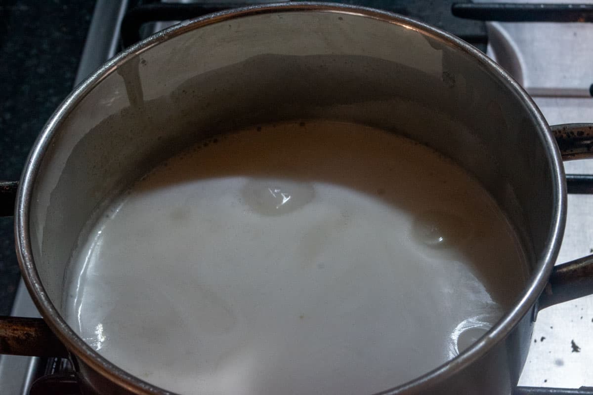 The condensed milk mixture bring brought to the boil.