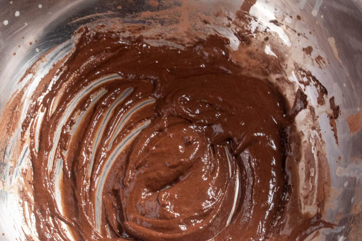 The wet ingredients have been added making a creamy chocolate batter. 