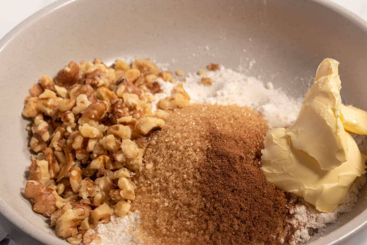 The ingredients for the walnut streusel inside a small plate.