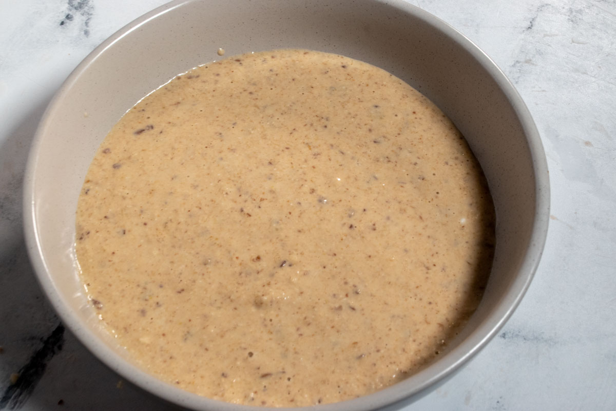 The mixture has been poured into a small, grey serving bowl.