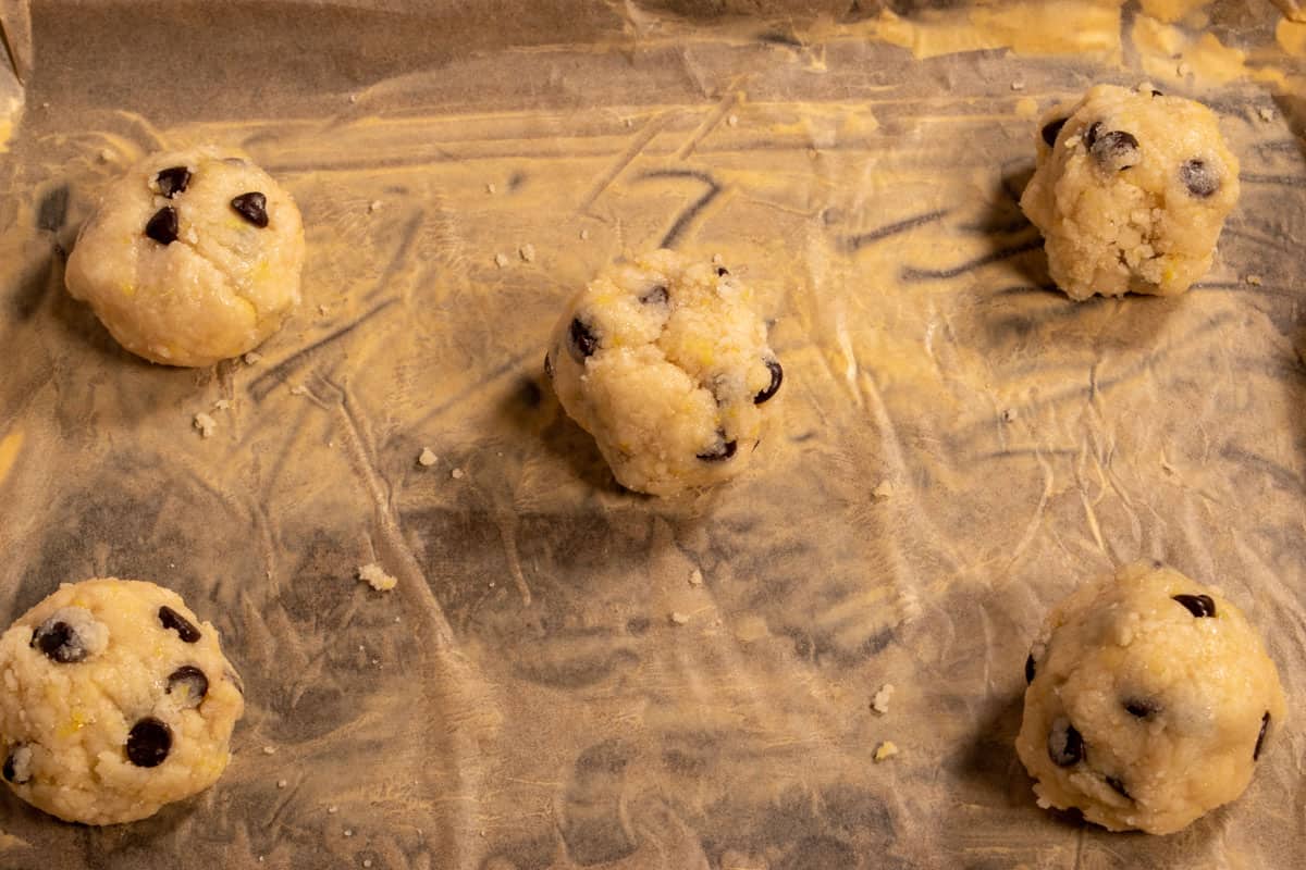 Cookie dough balls have been formed and placed onto the baking tray.