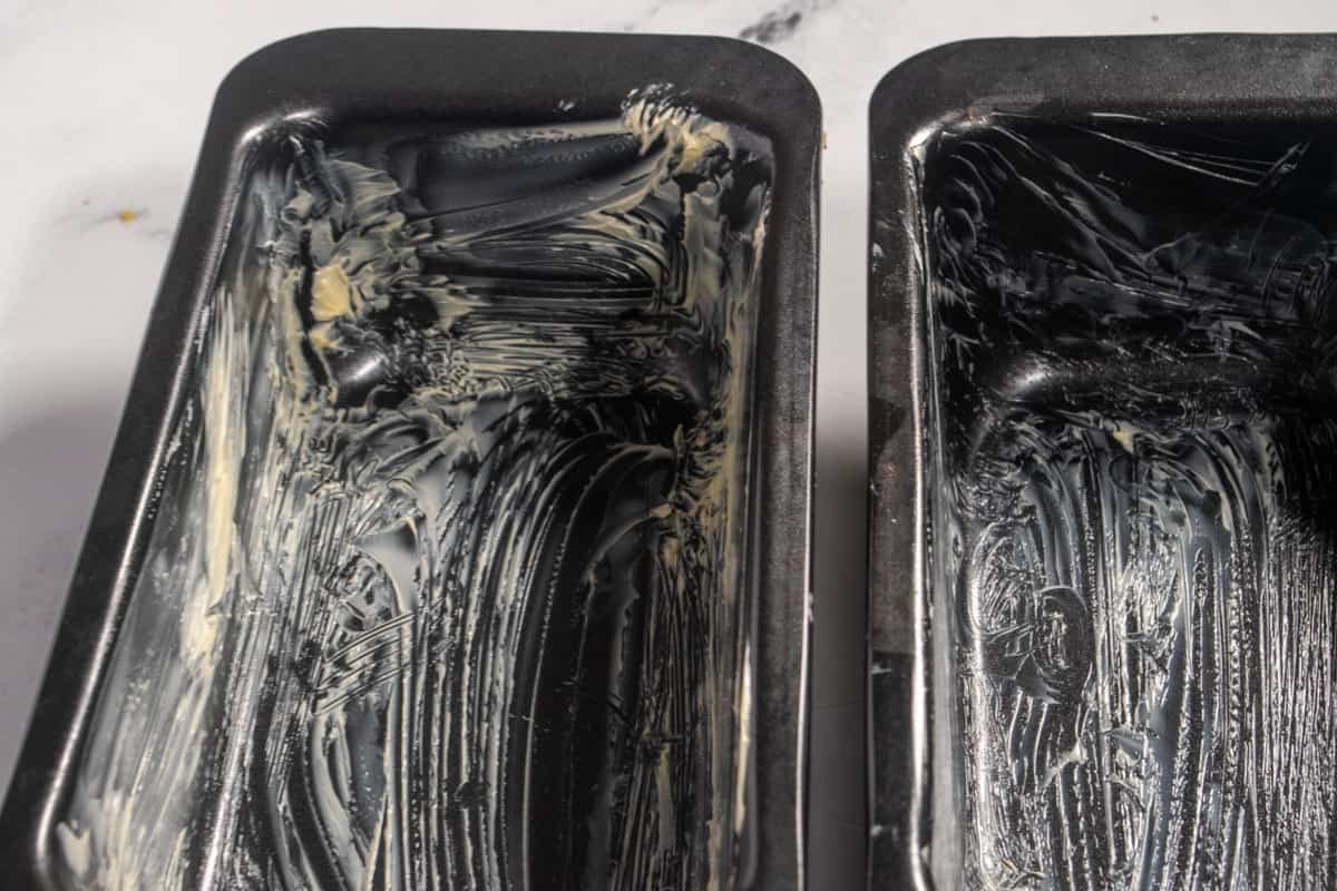 Two greased loaf cake tins. 