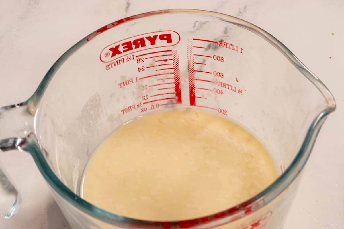 Vegan buttermilk curdling in a pyrex jug. 