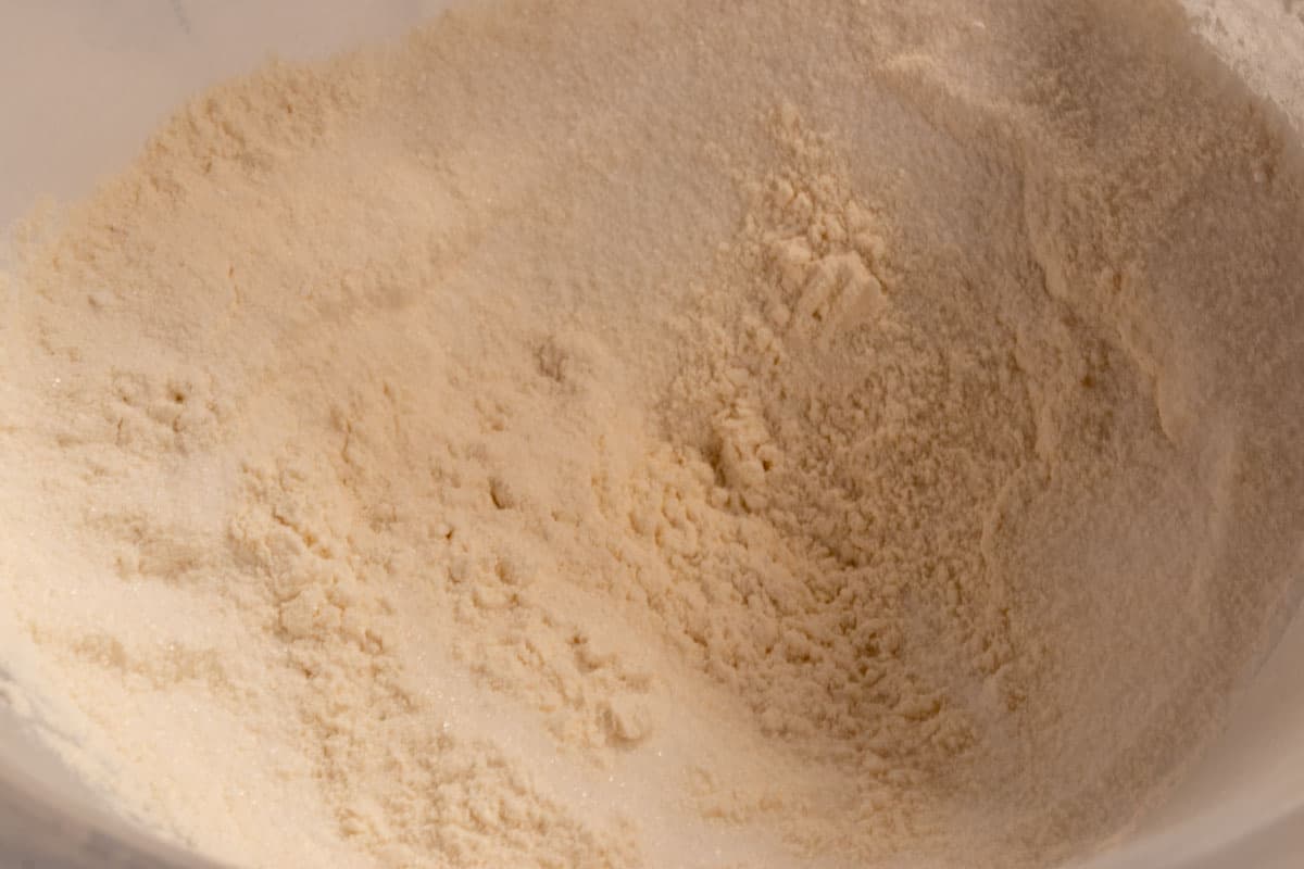 The dry cake ingredients combined inside a large mixing bowl. 
