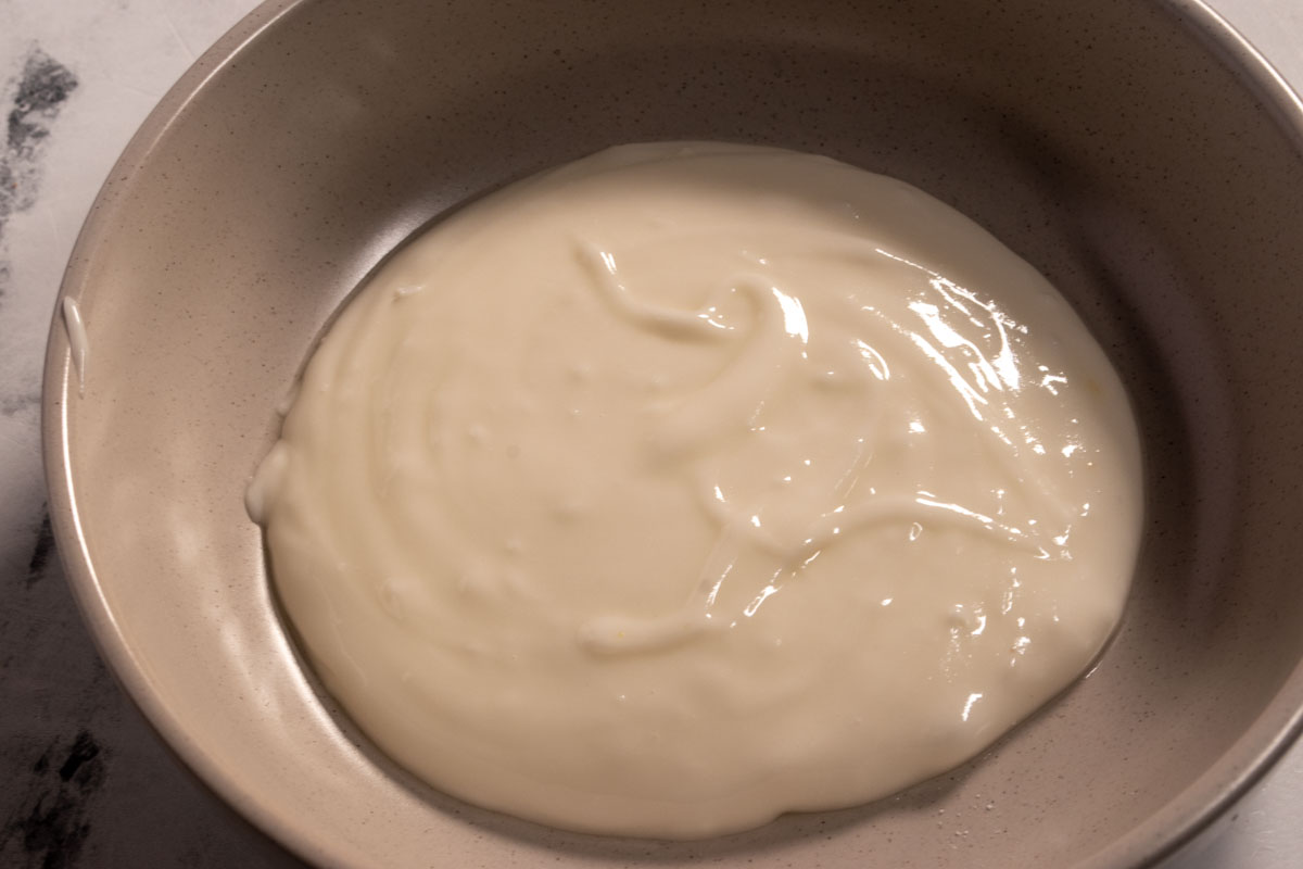 The lemon glaze, ready to be spooned onto the two cakes. 