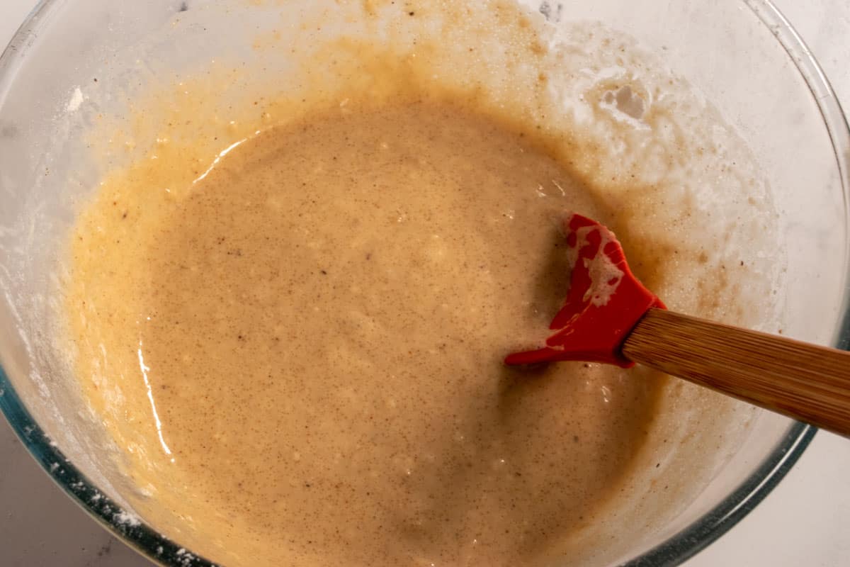 The wet cake ingredients have been folded in creating a smooth maple batter.