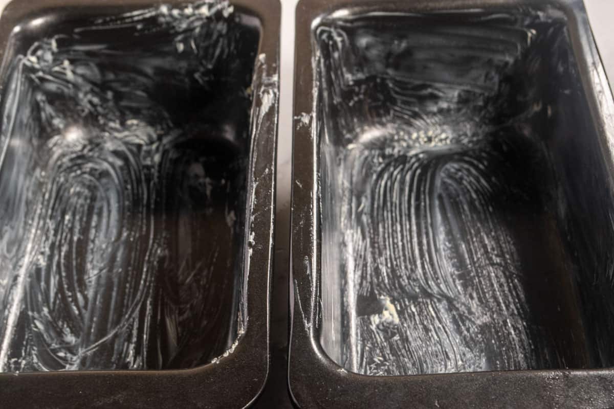 Two greased loaf cake tins. 