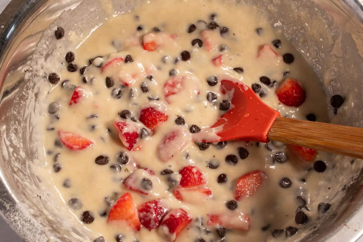 The chopped strawberries and the chocolate chips have been folded into the cake batter, 