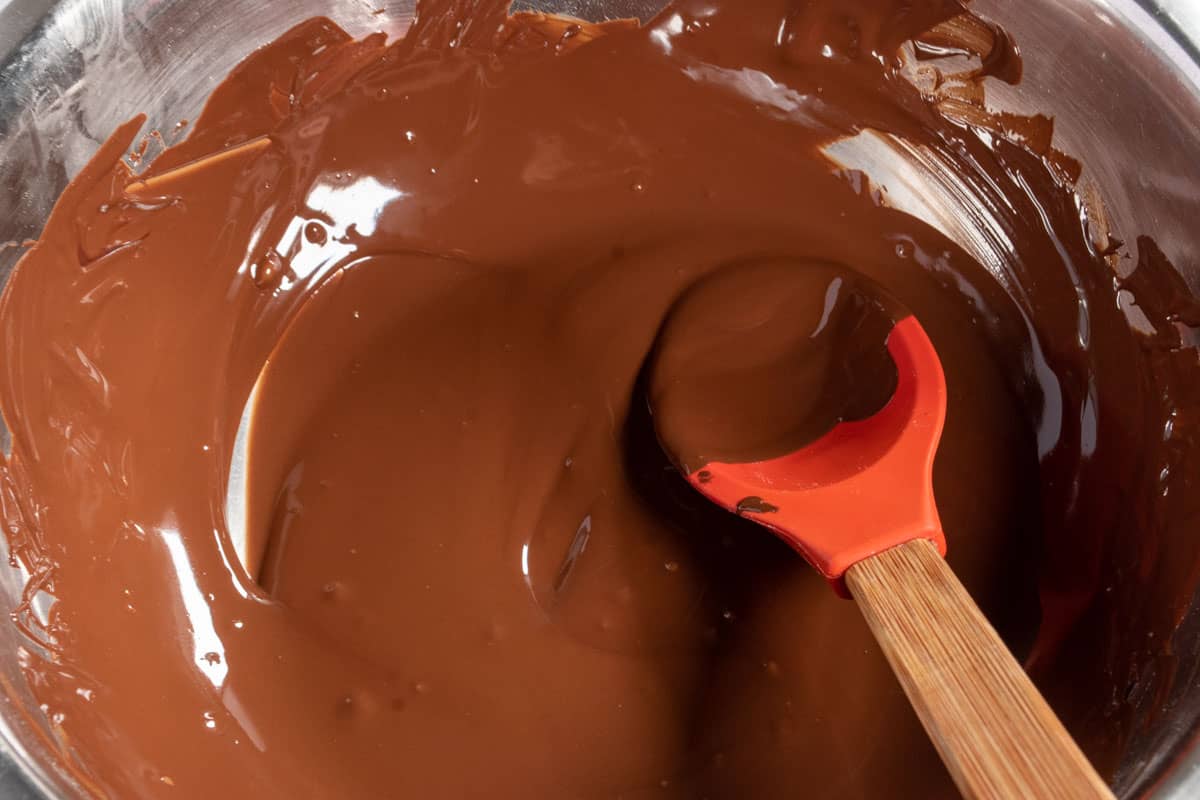 The chocolate being melted in a heatproof bowl. 