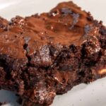 An incredibly delicious slices of my eggless fudgy brownies recipe which is gooey and warm, waiting to be eaten.