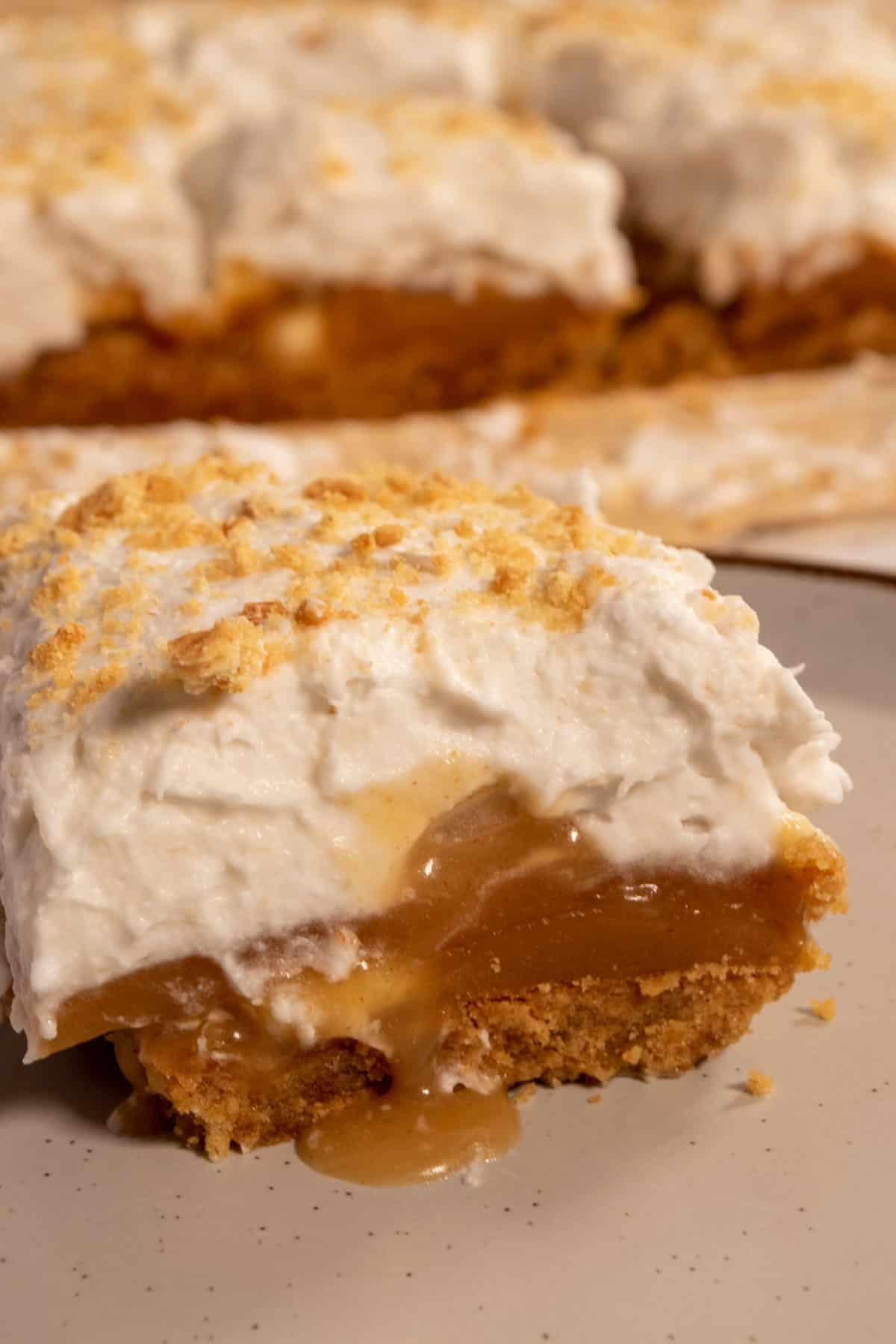 A close up banoffee slice. The cream on top is so fluffy.  