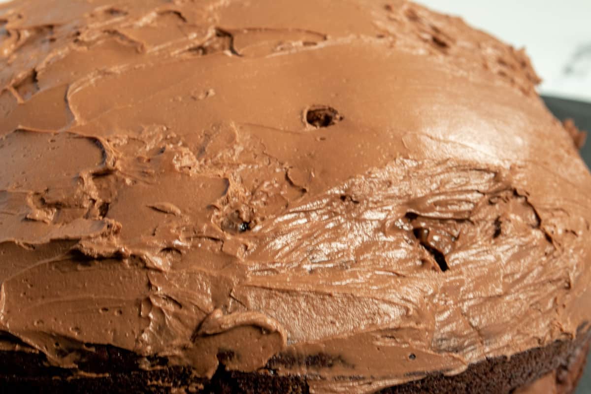Chocolate mousse has also been spread on the top of the cake now too. It is ready to be sliced and served. 