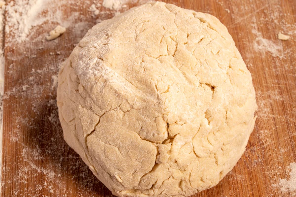 The dough has been kneaded into a neater bowl. 