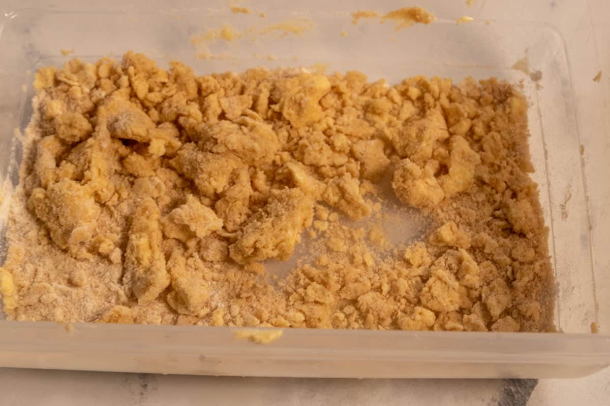 The streusel ingredient topping combined together inside a plastic container. 