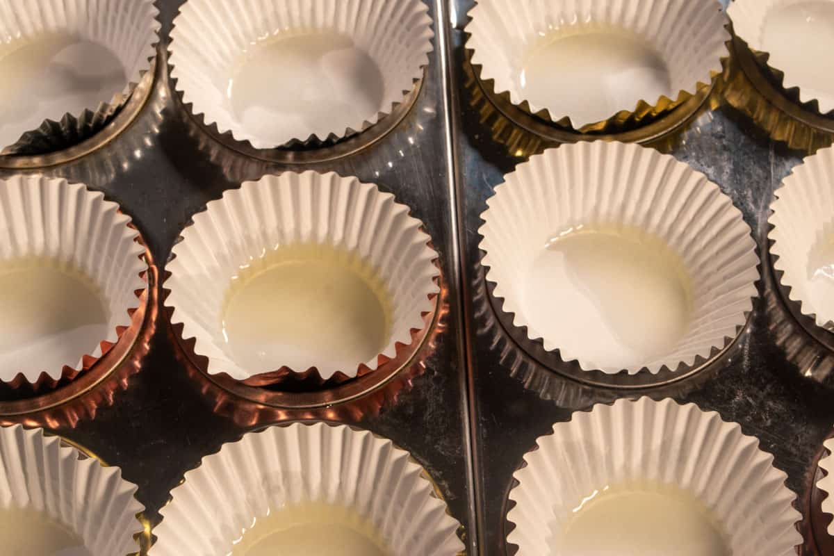 Cupcake liners greased with vegetable oil. 