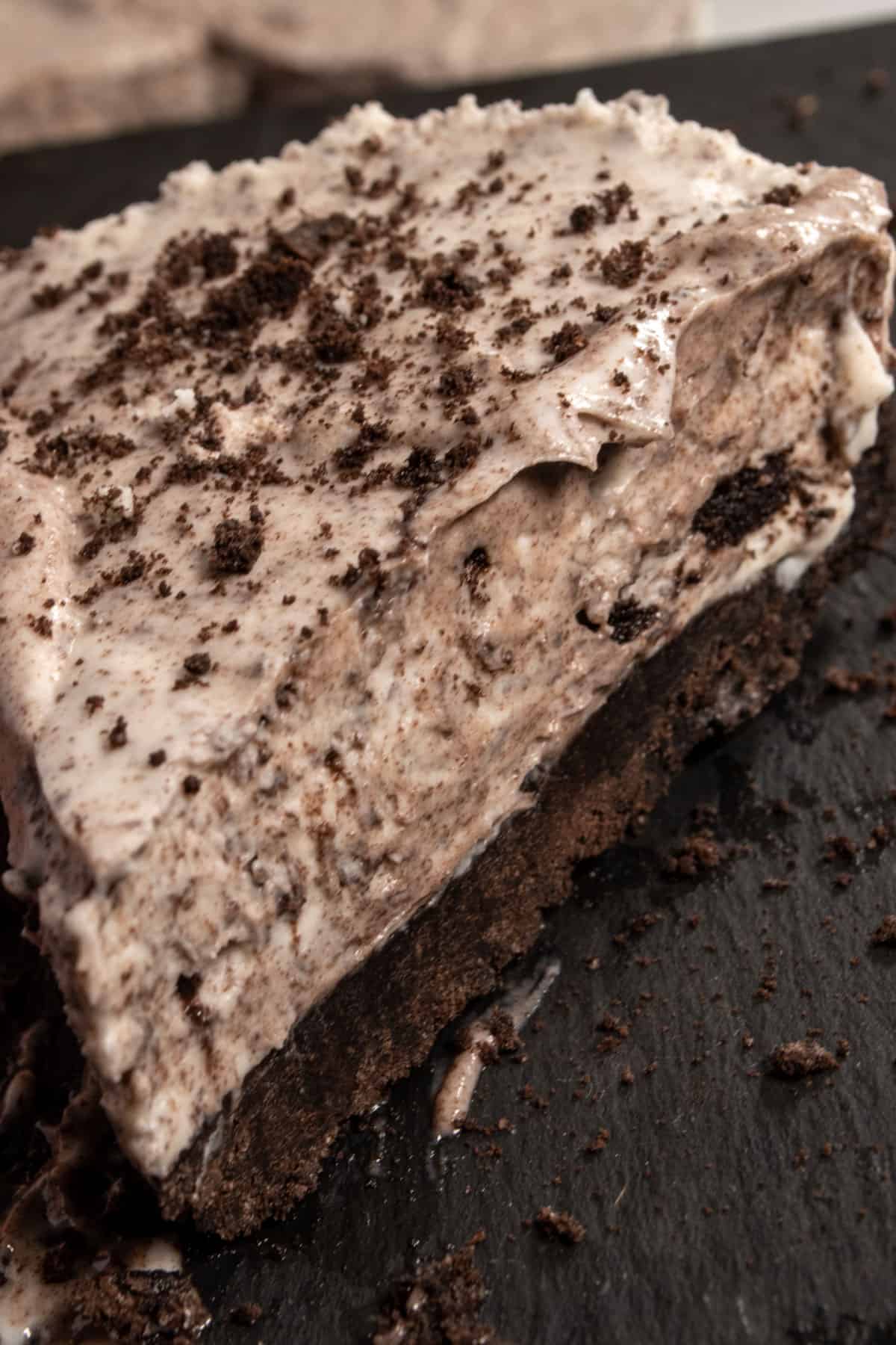 A close up image of a slice of cheesecake. It is silky smooth.