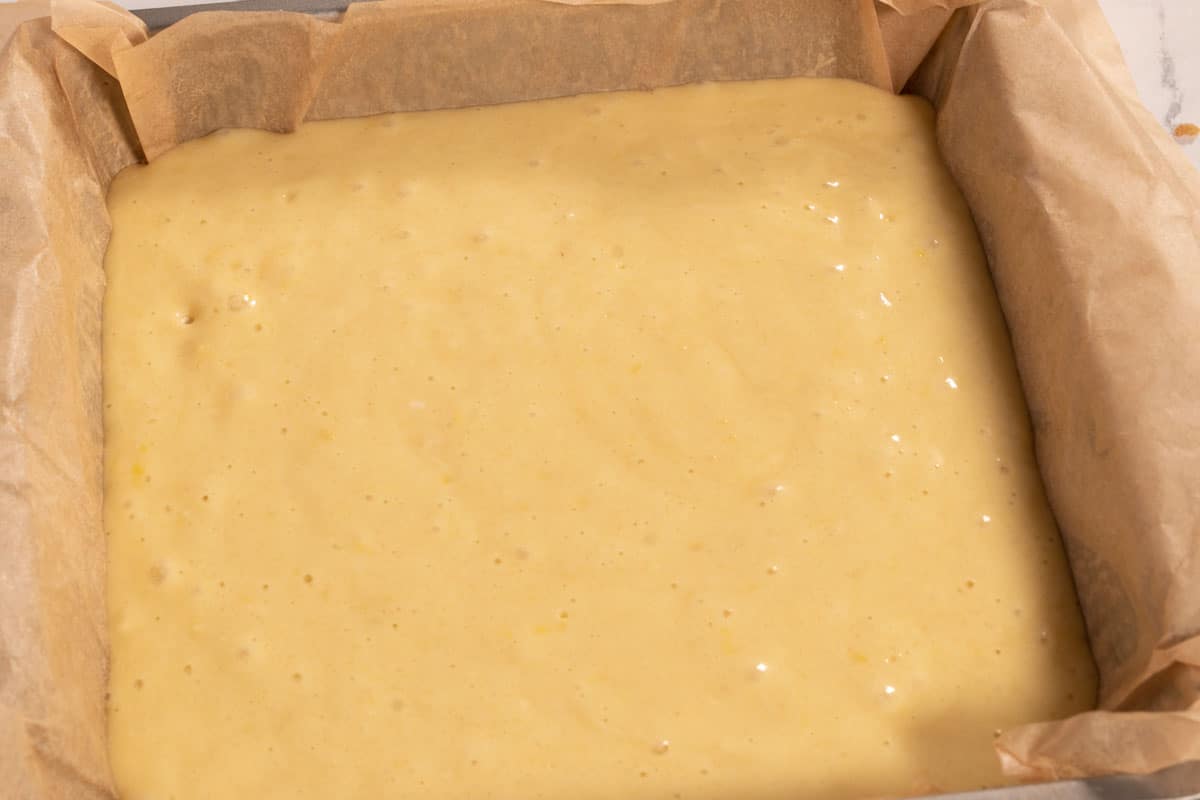 The cake batter has been poured into the prepared tin.
