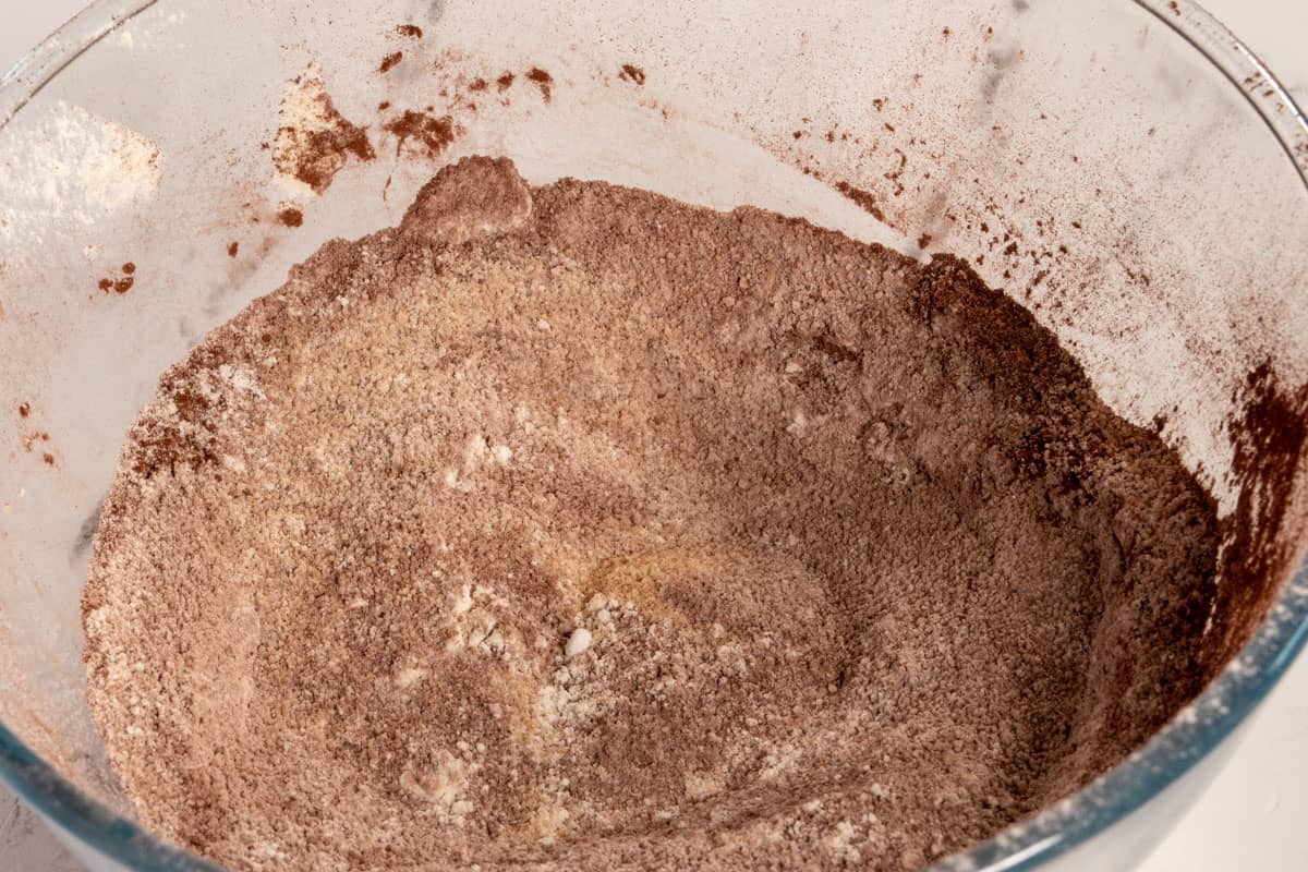 The dry cake ingredients combined inside a large bowl. 