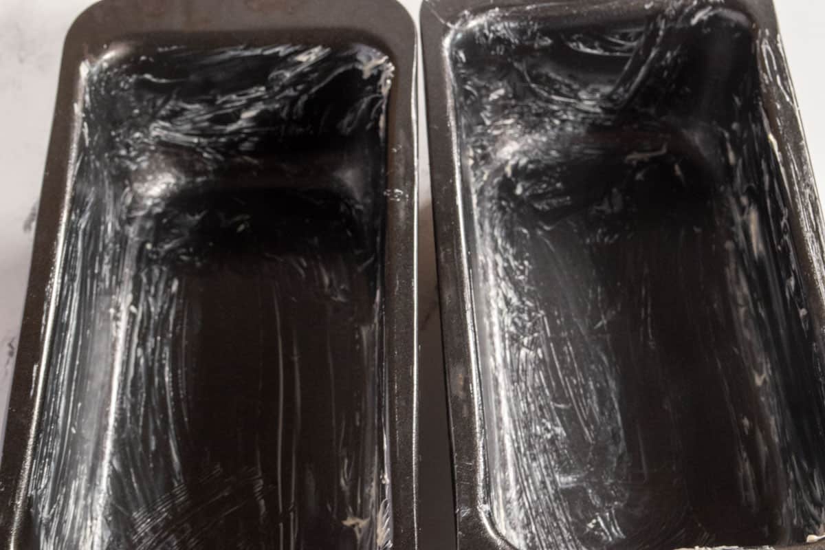 Two greased loaf cake tins.