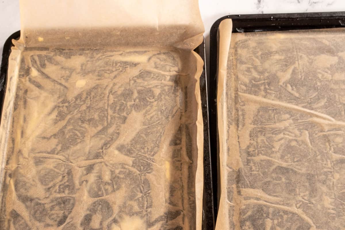 Two baking trays lined with parchment paper. 