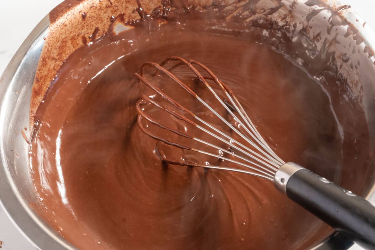 The chocolate mixture has been boiled and it has thickened more. 