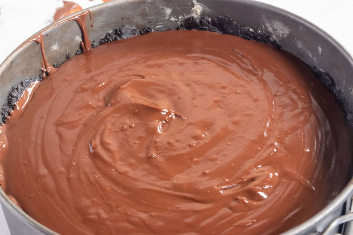 The filling has been poured into the tin over the crust. 