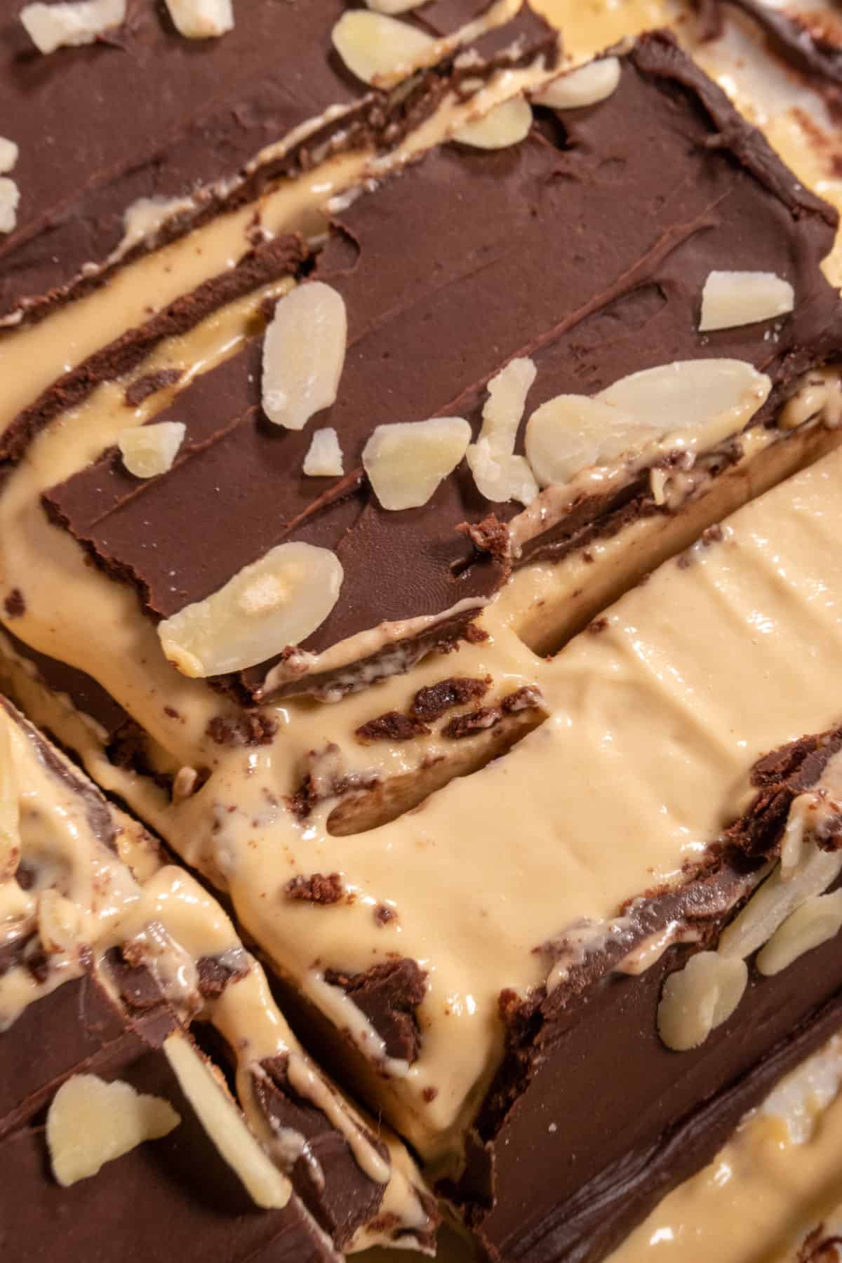 An aerial image showing several of my vegan nanaimo bar slices. The chocolate has broken on some of them.