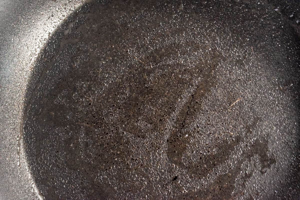 A hot frying pan, greased with oil. 