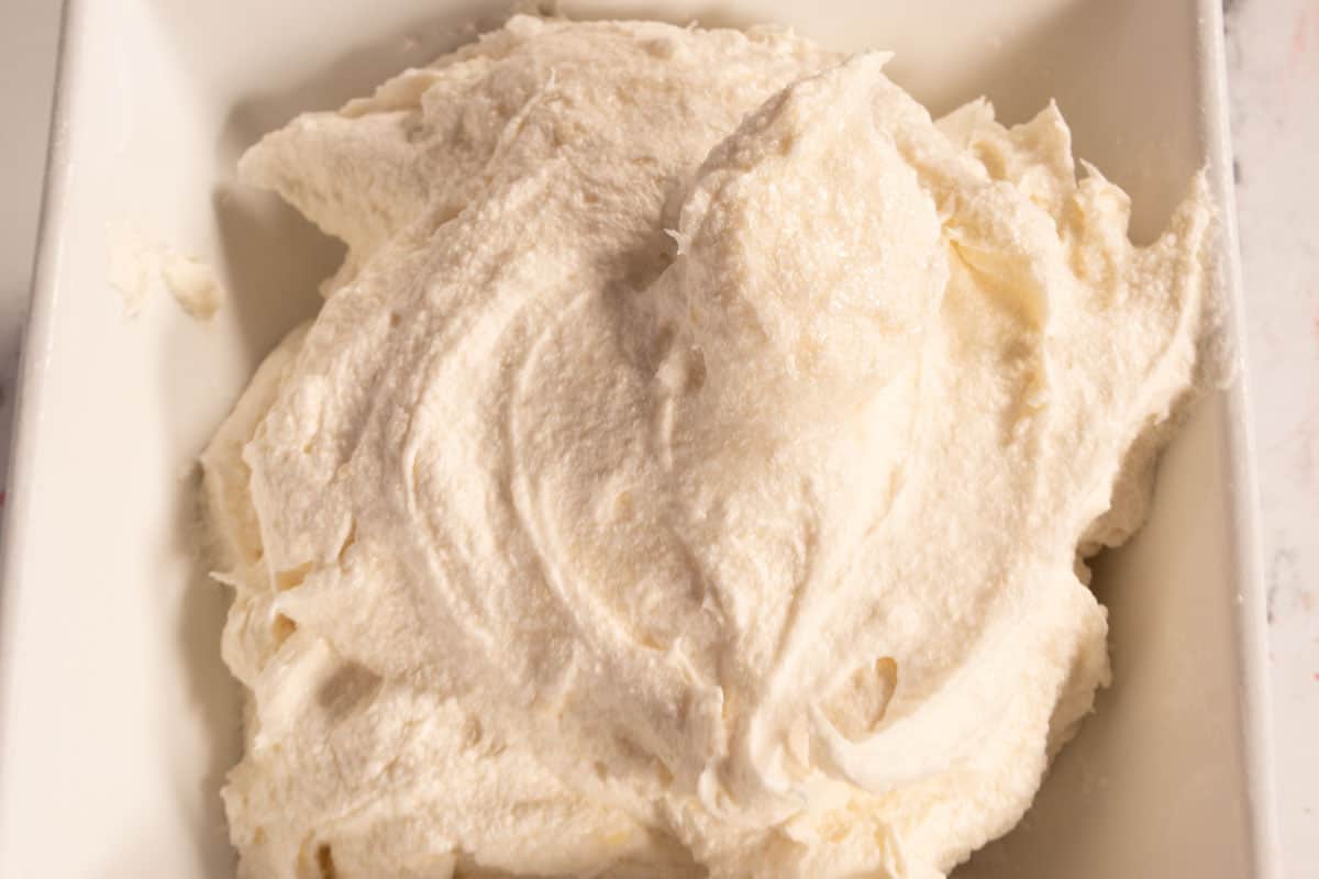 Vegan cream cheese frosting inside a small bowl. 